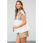 Embroidered Empire Tassel Tie Top in WHiteTHMLTOPS