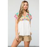 Embroidered Empire Tassel Tie Top in WHiteTHMLTOPS