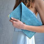 Large soft suede clutch in teal blue: Large with gold hardwareANA KOUTSIACCESS