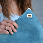 Large soft suede clutch in teal blue: Large with gold hardwareANA KOUTSIACCESS