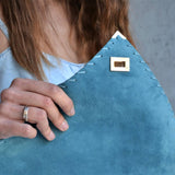 Large soft suede clutch in teal blue: Large with gold hardwareANA KOUTSIACCESS