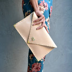 Symmetria leather clutch in nude: Gold / LargeANA KOUTSI