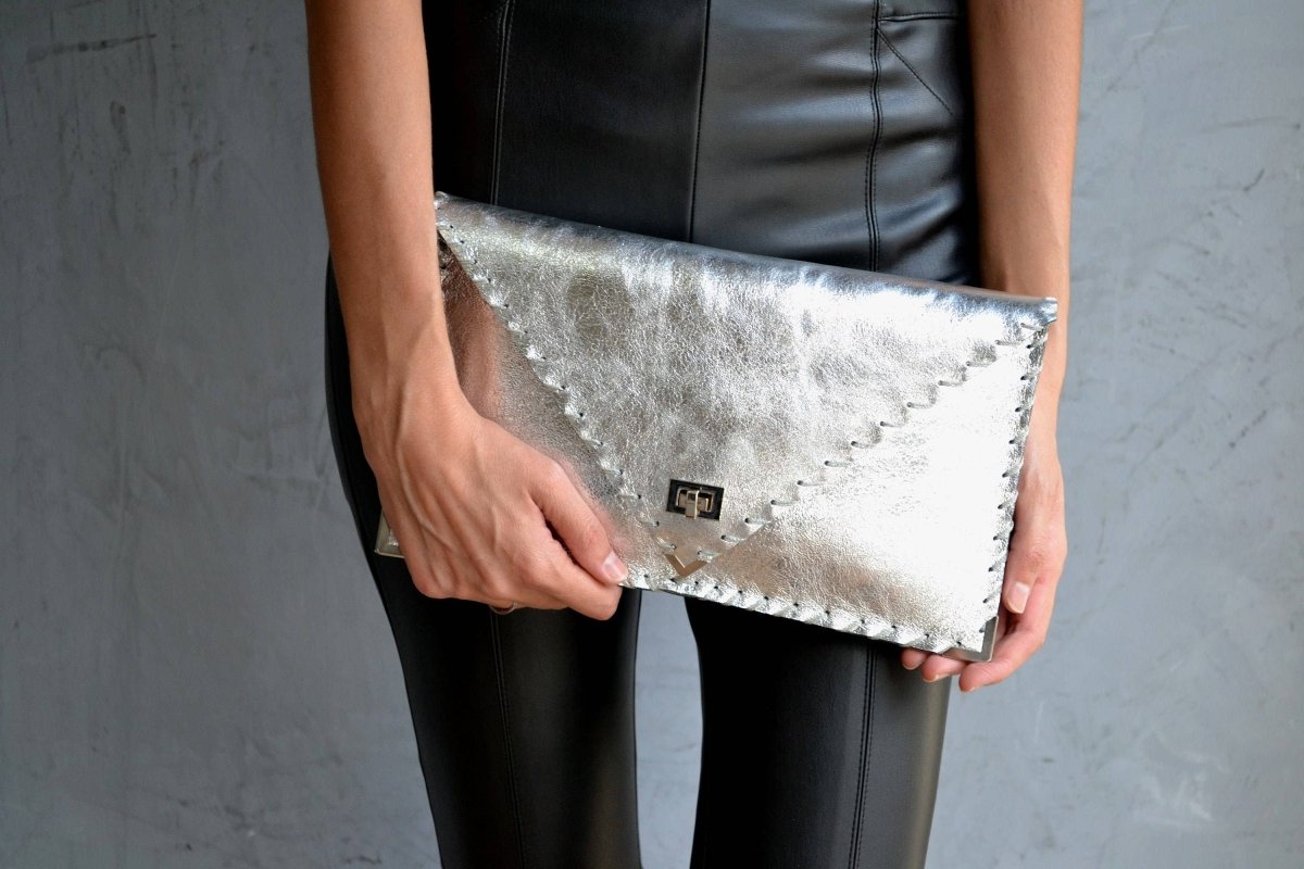 Symmetria leather clutch in silverANA KOUTSI