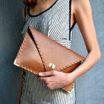 Symmetria leather clutch in tabac brown: Gold / SmallANA KOUTSI