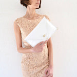 Symmetria leather clutch in white: GoldANA KOUTSIACCESS