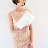 Symmetria leather clutch in white: GoldANA KOUTSIACCESS