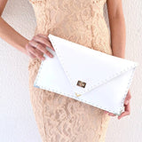 Symmetria leather clutch in white: GoldANA KOUTSIACCESS