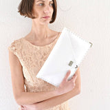 Symmetria leather clutch in white: GoldANA KOUTSIACCESS