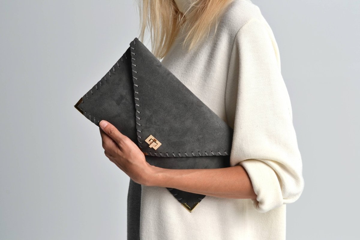 Symmetria soft clutch in dark gray: GoldANA KOUTSI